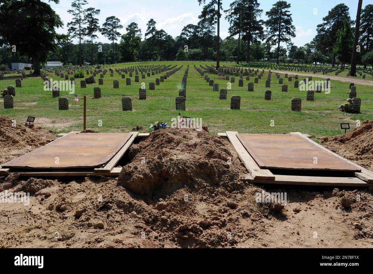 This photo taken june 12 2013 shows empty and recently filled graves