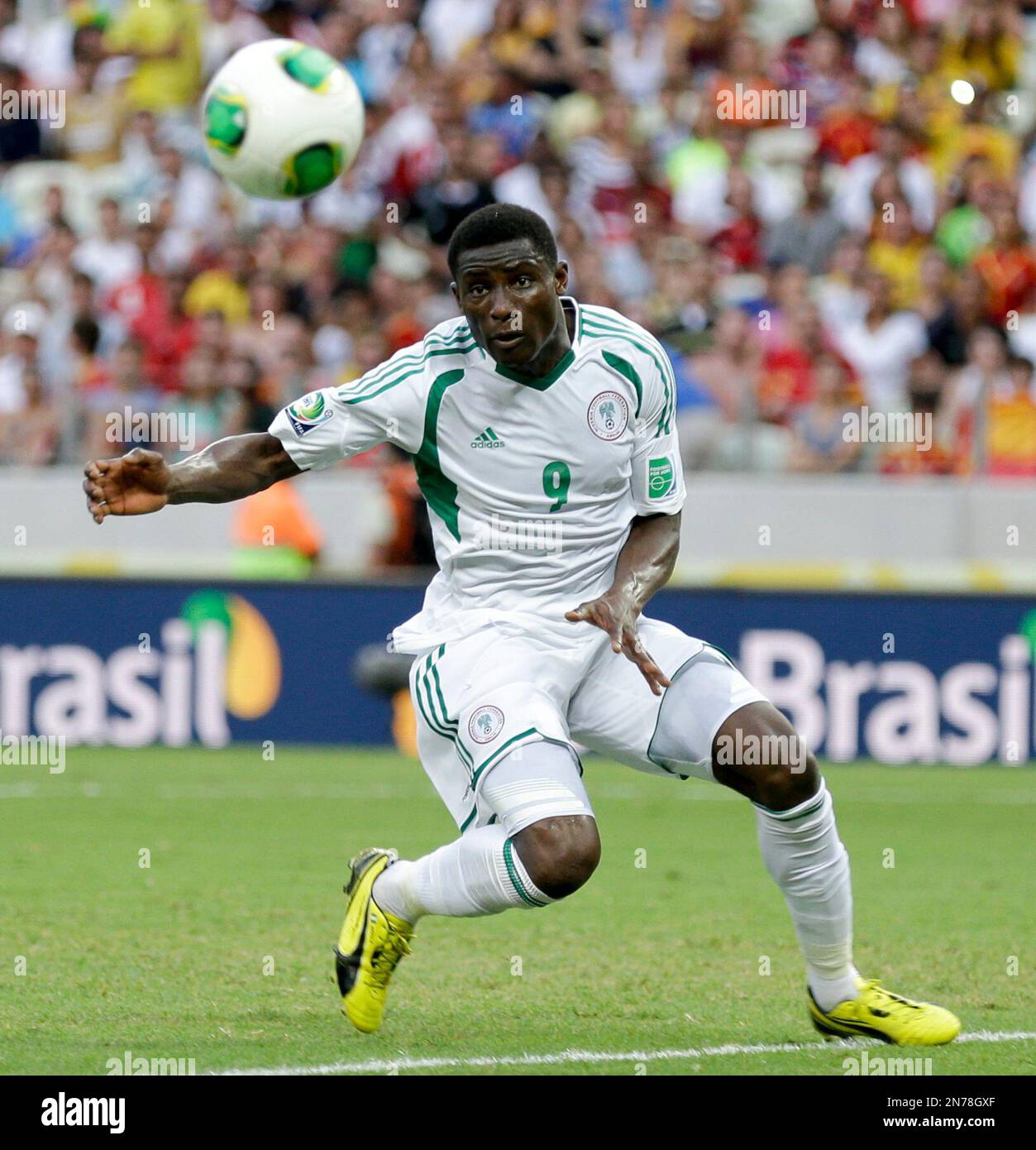 Nigeria's Joseph Akpala views the ball during the soccer Confederations Cup group B match between Nigeria and Spain at the Castelao stadium in Fortaleza, Brazil, Sunday, June 23, 2013. (AP Photo/Natacha Pisarenko) Stock Photo