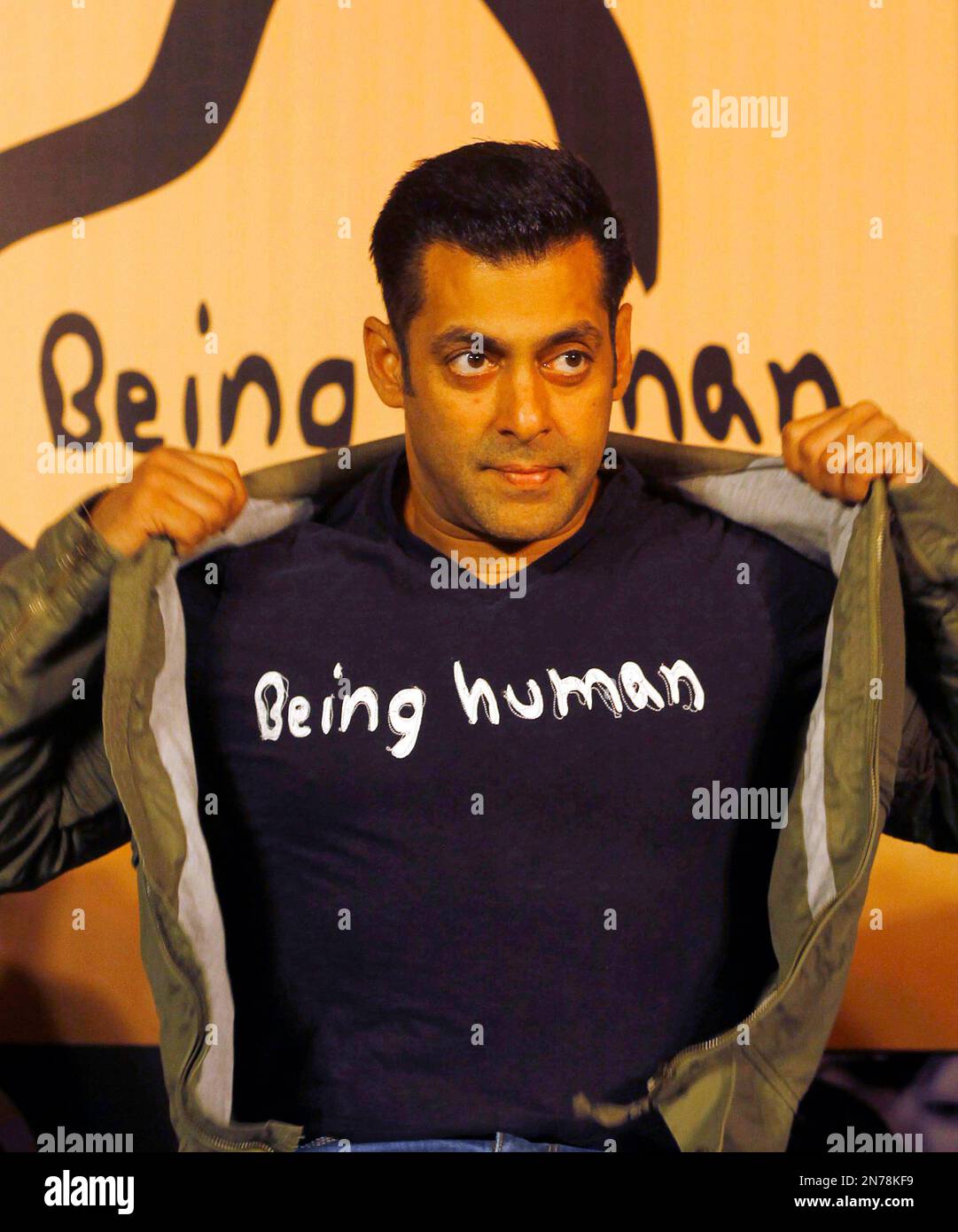 FILE – In this Thursday, 17, 2013 file photo, Bollywood star Salman Khan poses wearing a Being T-shirt during the launch of Being Human's first flagship store in Mumbai, India.
