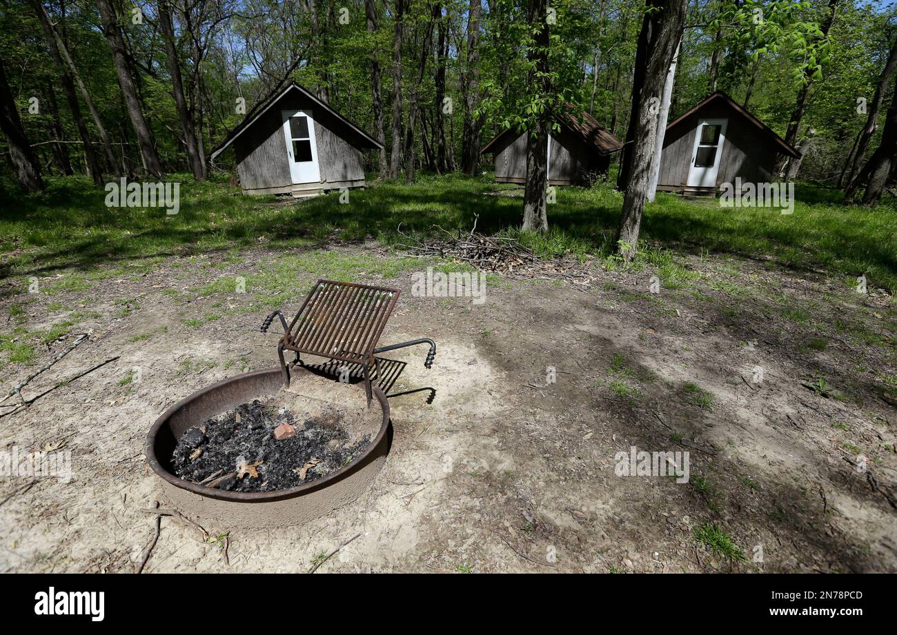 This Tuesday, May 14, 2013, file photo shows a fire pit and cabins at