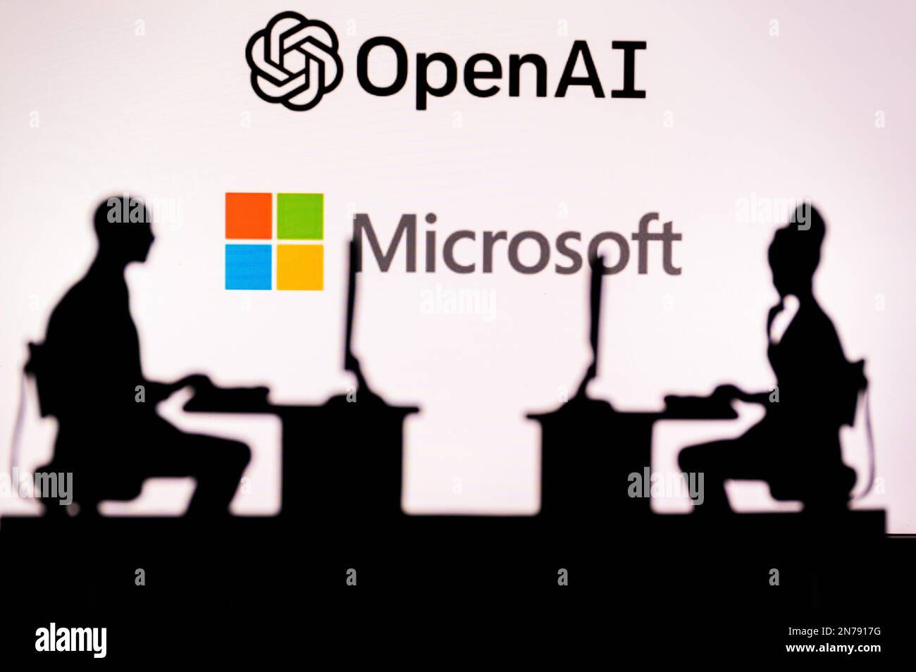 JAPAN, TOKYO. JANUARY 30, 2023: Open AI. Collaboration Leads to Progress: Two Developers Working Together Under the Company's Logo Stock Photo