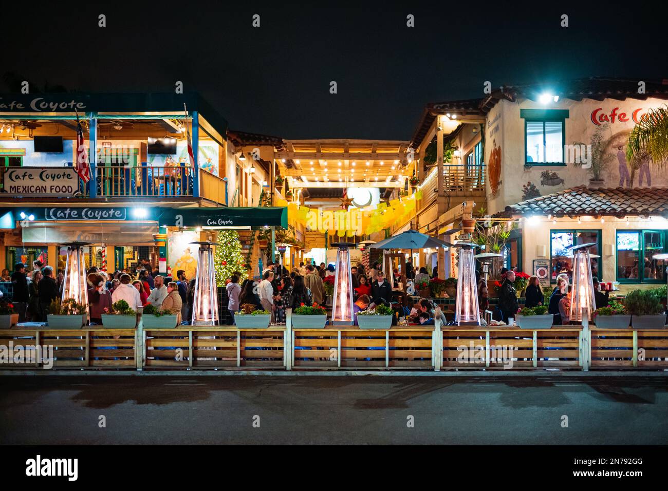San Diego, CA, USA - Dec 27, 2022: Tourist of Old Town San Diego enjoy dinner and the night life at an outdoor restaurant during a December evening. Stock Photo