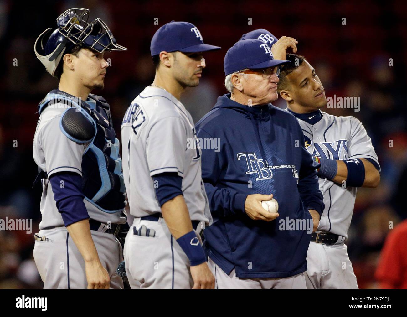 Tampa Bay Rays manager Joe Maddon waits with infielders for a relief