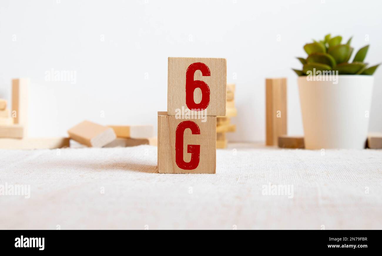 The 3d rendering 6g text gold surface glow in dark image for mobile technology content. Stock Photo