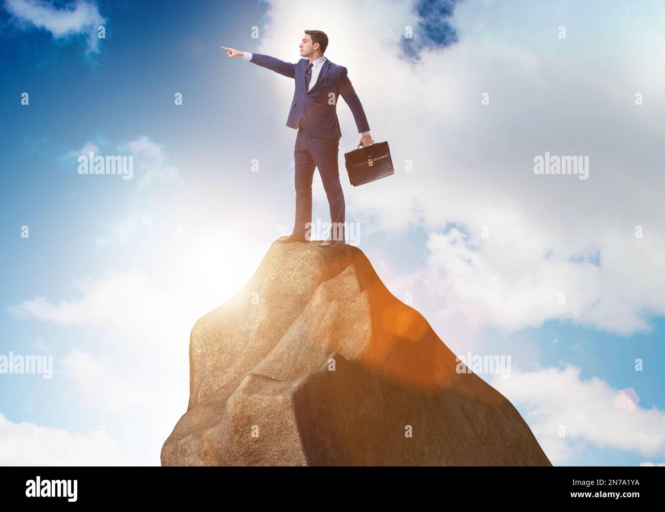 The businessman at the top of mountain Stock Photo - Alamy