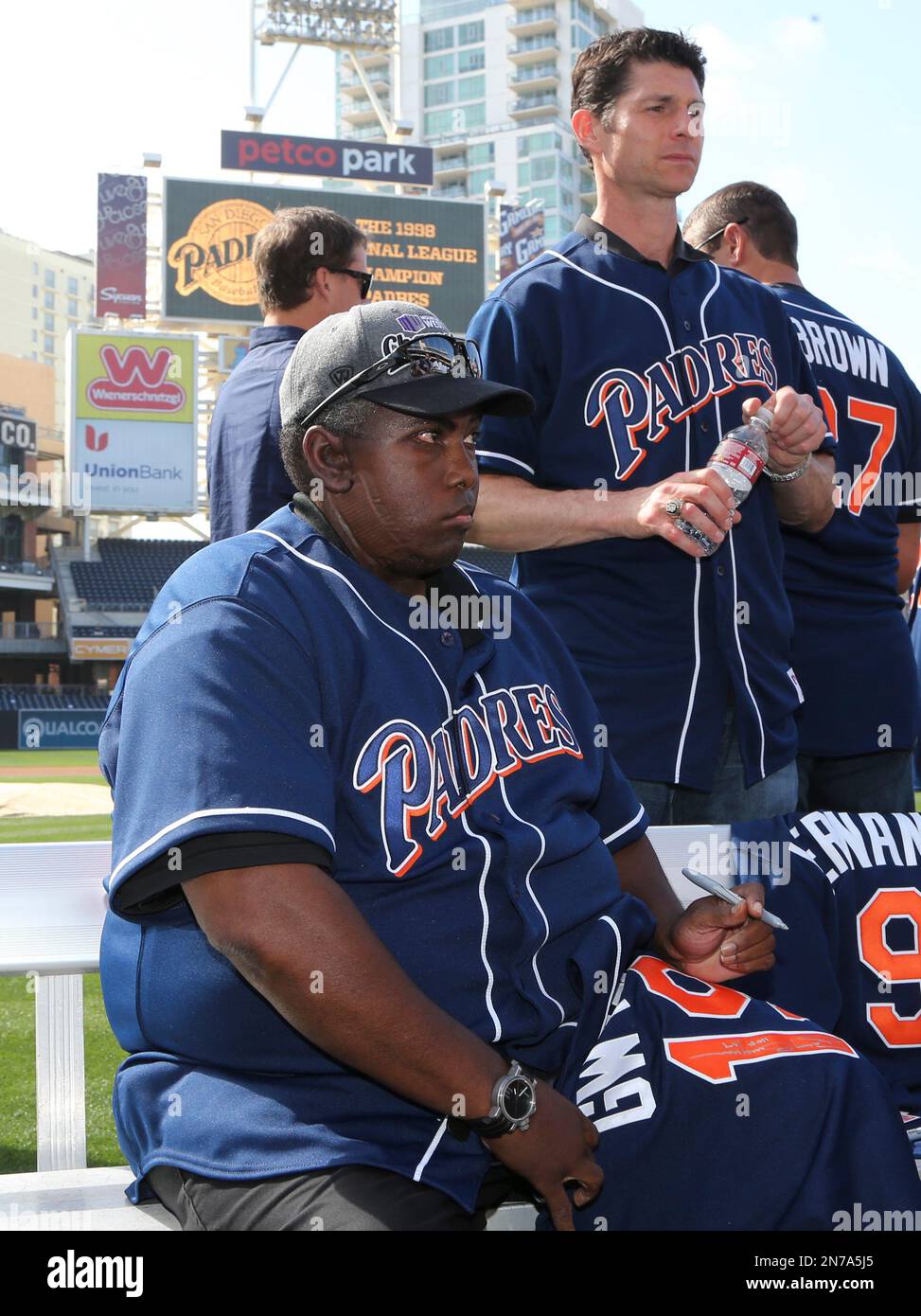 Hall of Fame ball player Tony Gwynn signs a 1998 jersey during