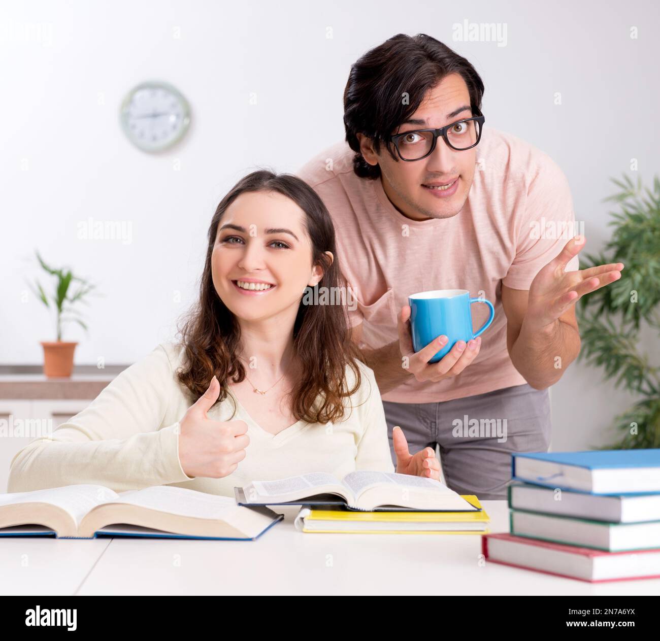The students preparing for exam together at home Stock Photo - Alamy