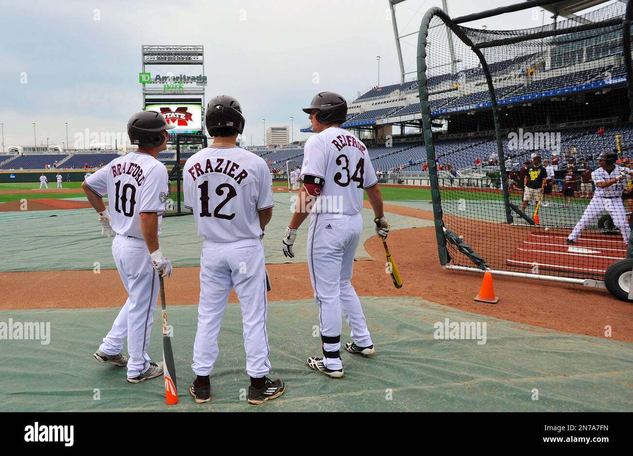 Mississippi State's C.T. Bradford (10), Adam Frazier (12) and