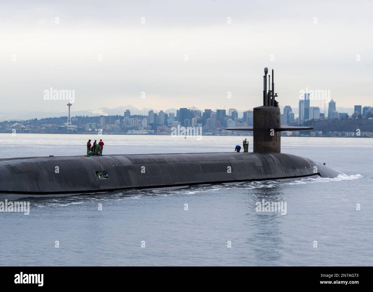 230209-N-ED185-1327  PUGET SOUND, Wash. (Feb. 9, 2023) The Ohio-class ballistic missile submarine USS Louisiana (SSBN 743) transits Puget Sound past the Seattle skyline following a 41-month engineered refueling overhaul at Puget Sound Naval Shipyard and Intermediate Maintenance Facility, February 9, 2023. Louisiana is one of eight ballistic-missile submarines stationed at Naval Base Kitsap-Bangor, providing the most survivable leg of the strategic deterrence triad for the United States. (U.S. Navy photo by Mass Communication Specialist 1st Class Brian G. Reynolds) Stock Photo