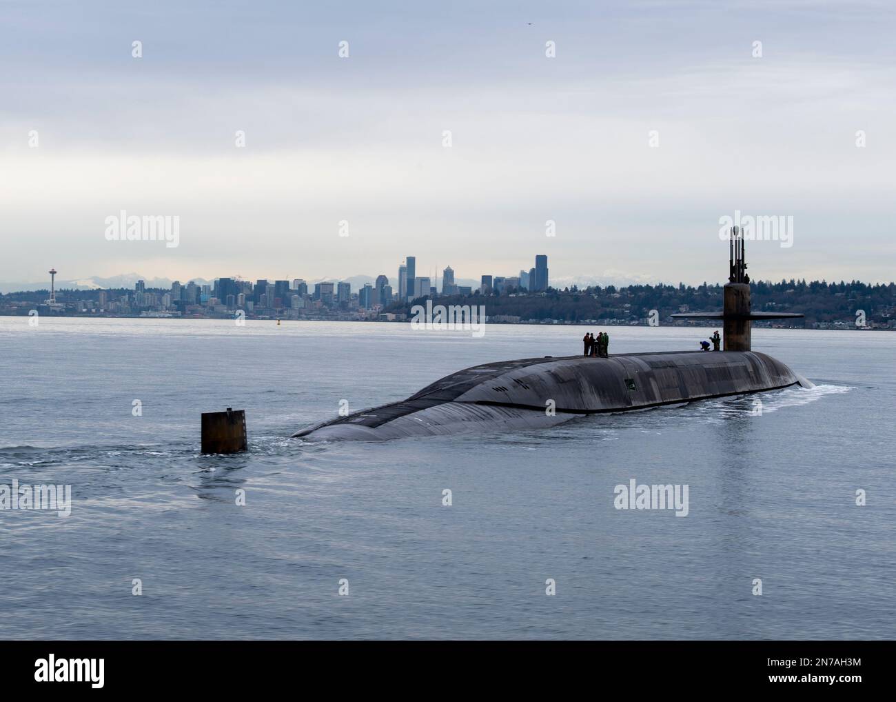 230209-N-ED185-1316  PUGET SOUND, Wash. (Feb. 9, 2023) The Ohio-class ballistic missile submarine USS Louisiana (SSBN 743) transits Puget Sound past the Seattle skyline following a 41-month engineered refueling overhaul at Puget Sound Naval Shipyard and Intermediate Maintenance Facility, February 9, 2023. Louisiana is one of eight ballistic-missile submarines stationed at Naval Base Kitsap-Bangor, providing the most survivable leg of the strategic deterrence triad for the United States. (U.S. Navy photo by Mass Communication Specialist 1st Class Brian G. Reynolds) Stock Photo