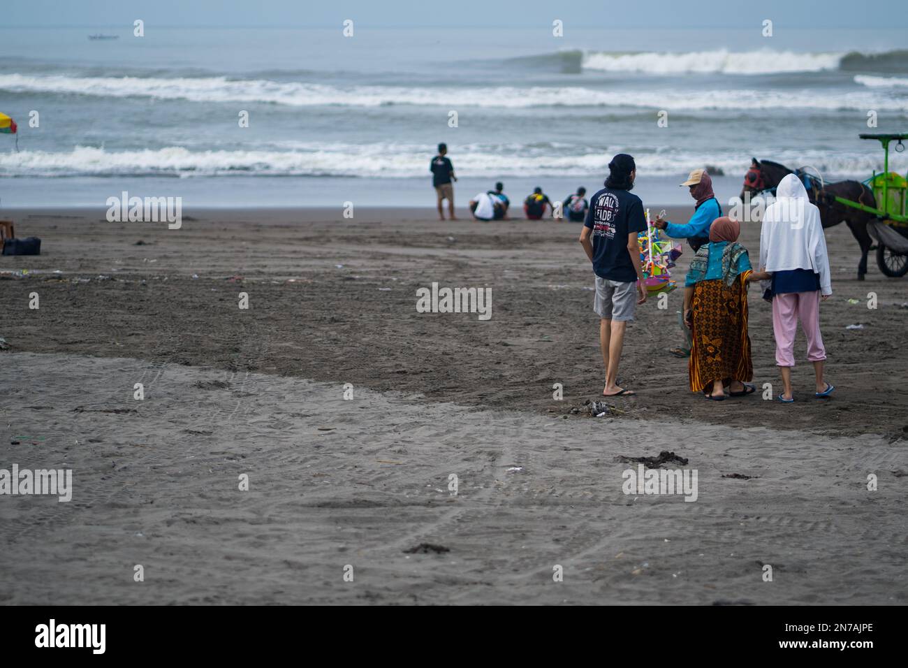 Yogyakarta, Indonesia. January 27, 2023. People activities on the Prangtritis Beach. Travel and street photography. Stock Photo