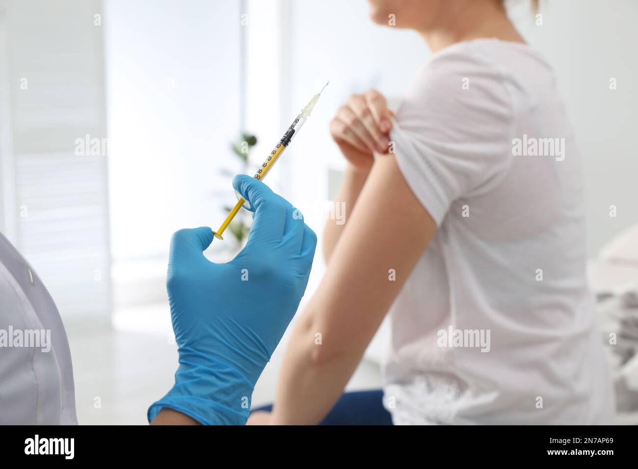 Immunization Injection Doctor giving injection to woman in hospital, closeup. Immunization ...