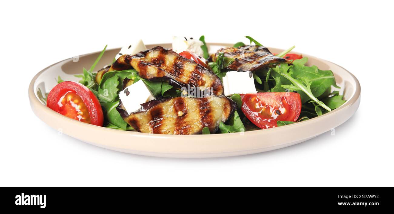 Delicious salad with roasted eggplant, feta cheese and arugula isolated on white Stock Photo