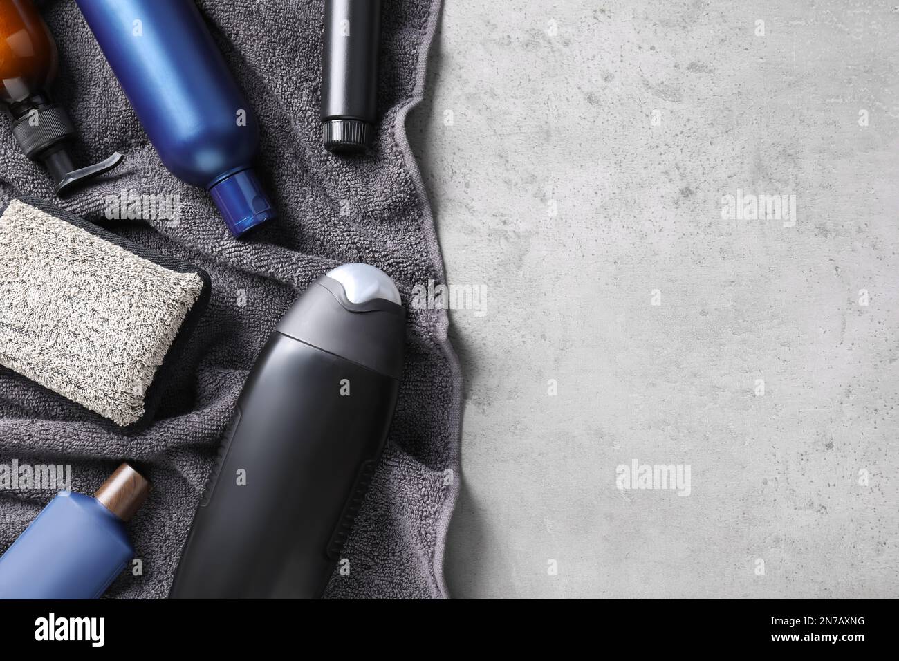Flat lay composition with men's cosmetics on light grey stone ...