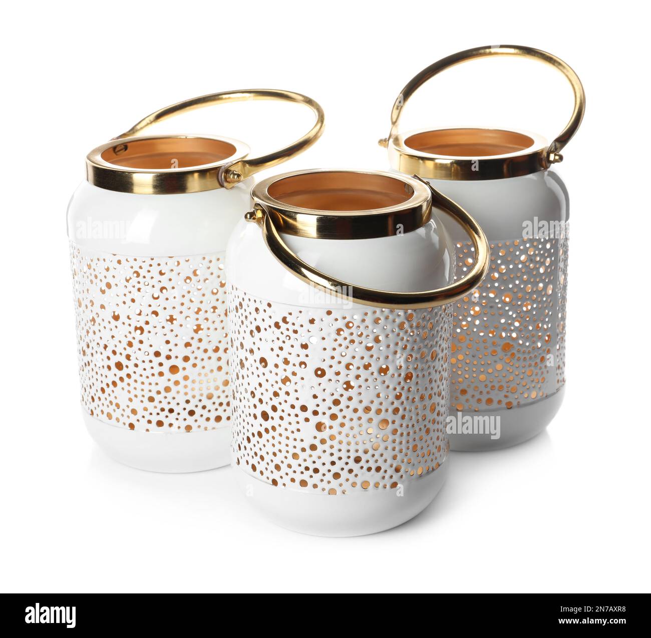 Stylish gold candle holders on white background Stock Photo - Alamy