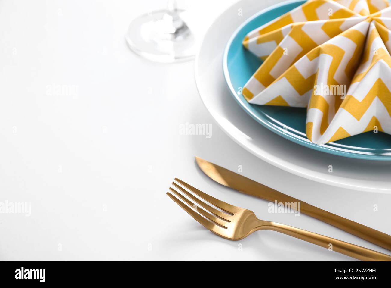 Stylish elegant table setting on white background Stock Photo - Alamy