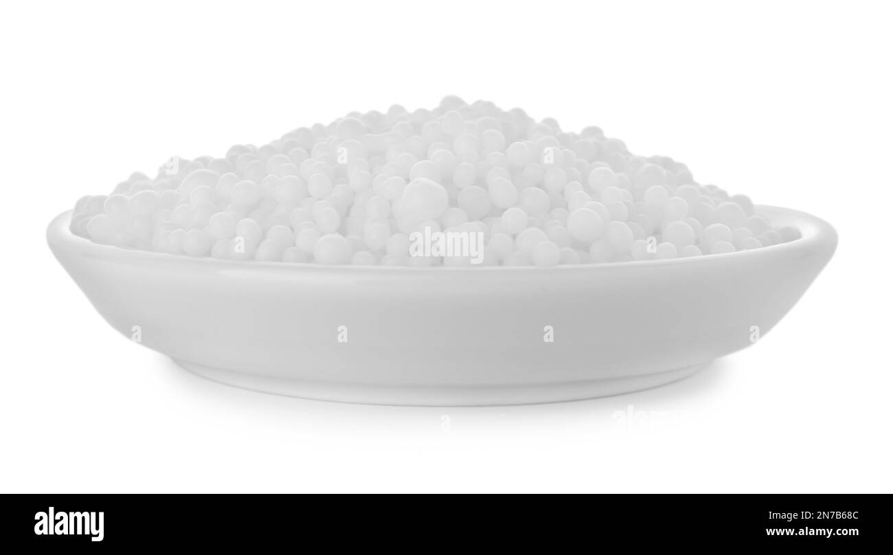 Pellets of ammonium nitrate isolated on white. Mineral fertilizer Stock Photo
