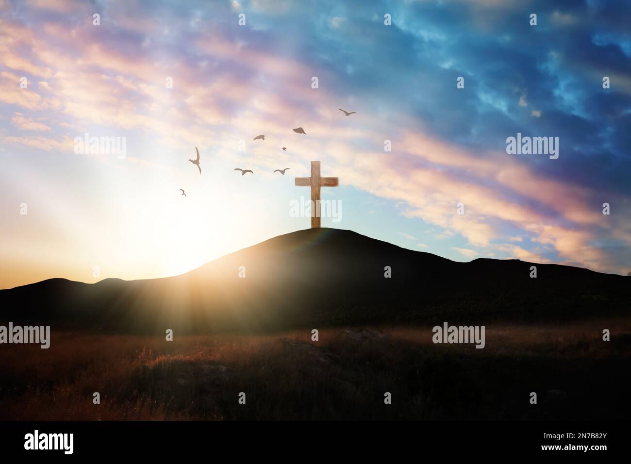 Christian cross on hill outdoors at sunrise. Resurrection of Jesus ...