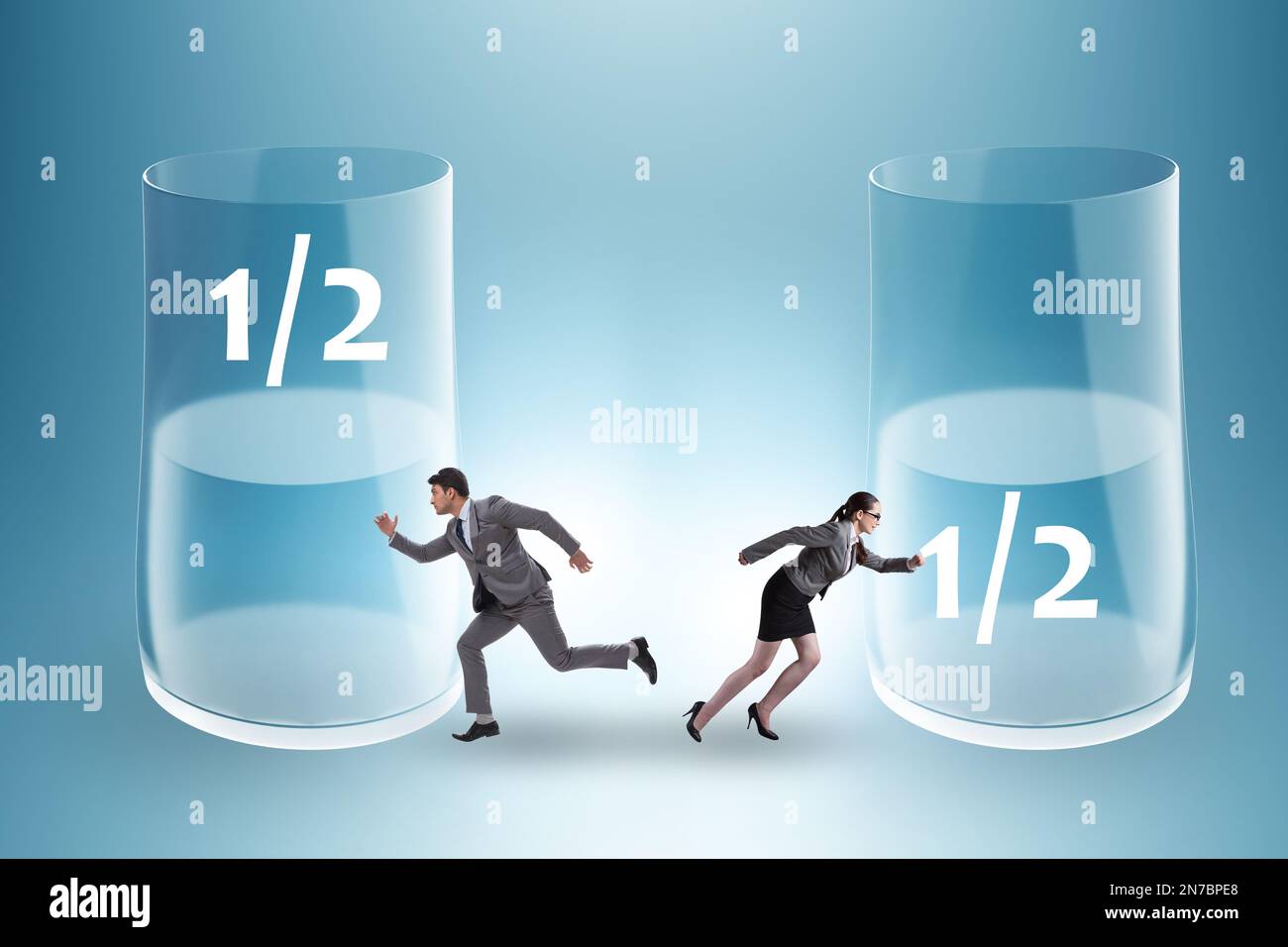 Businessman in the half empty half full glass concept Stock Photo Alamy