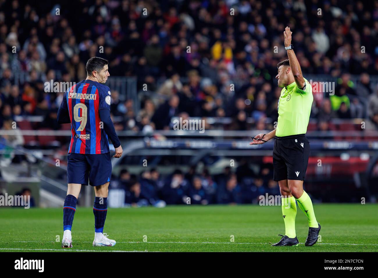 BARCELONA - JAN 25: Gil Manzano (R) and Lewandowski (L) argue during the Copa del Rey match between FC Barcelona and Real Sociedad at the Spotify Camp Stock Photo
