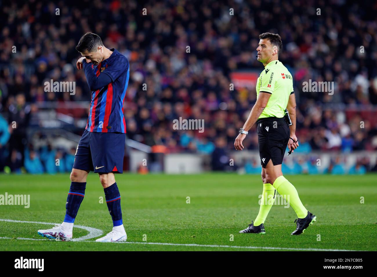 BARCELONA - JAN 25: Gil Manzano (R) and Lewandowski (L) argue during the Copa del Rey match between FC Barcelona and Real Sociedad at the Spotify Camp Stock Photo