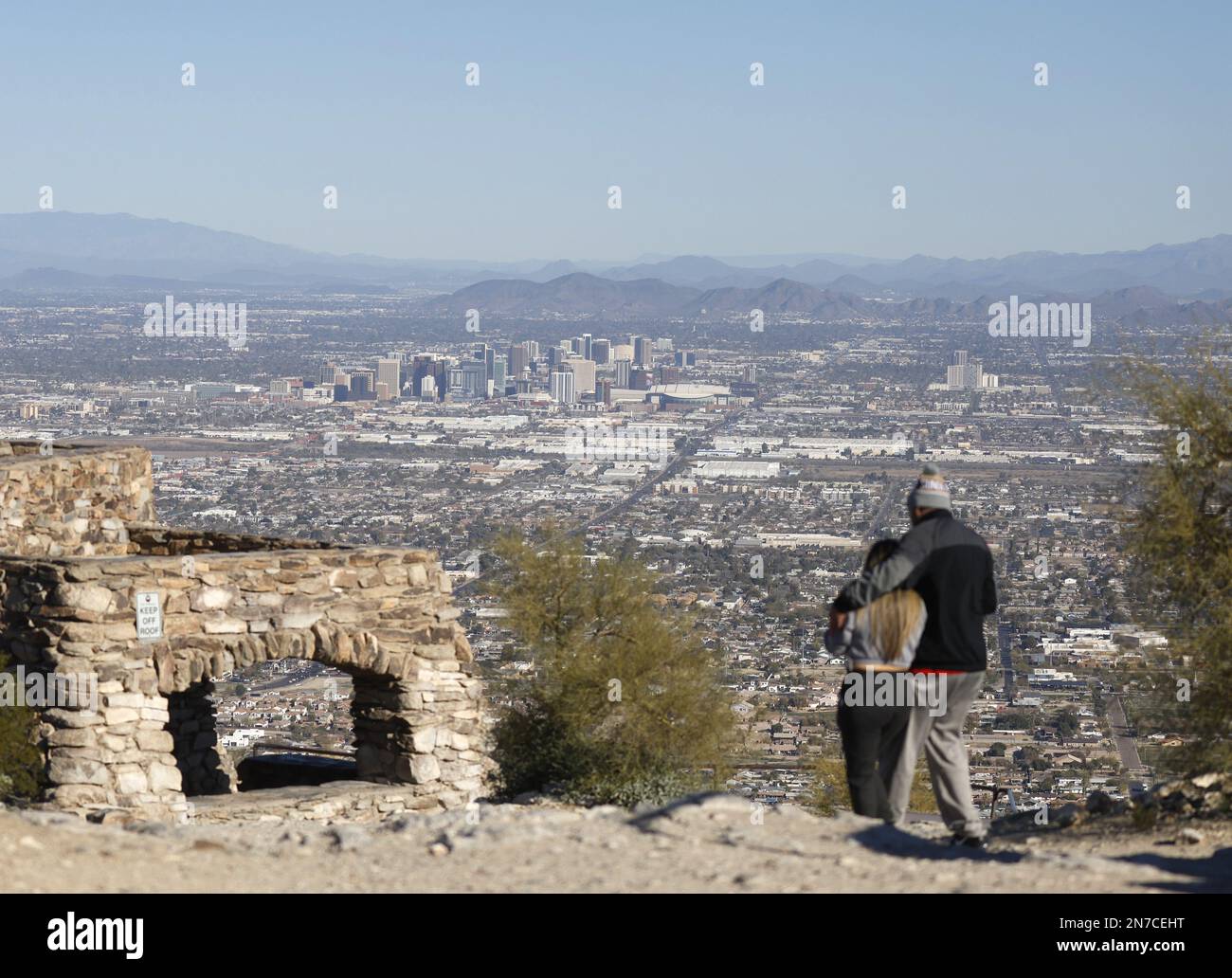 Phoenix, United States. 09th Feb, 2023. Two people walk with a view of