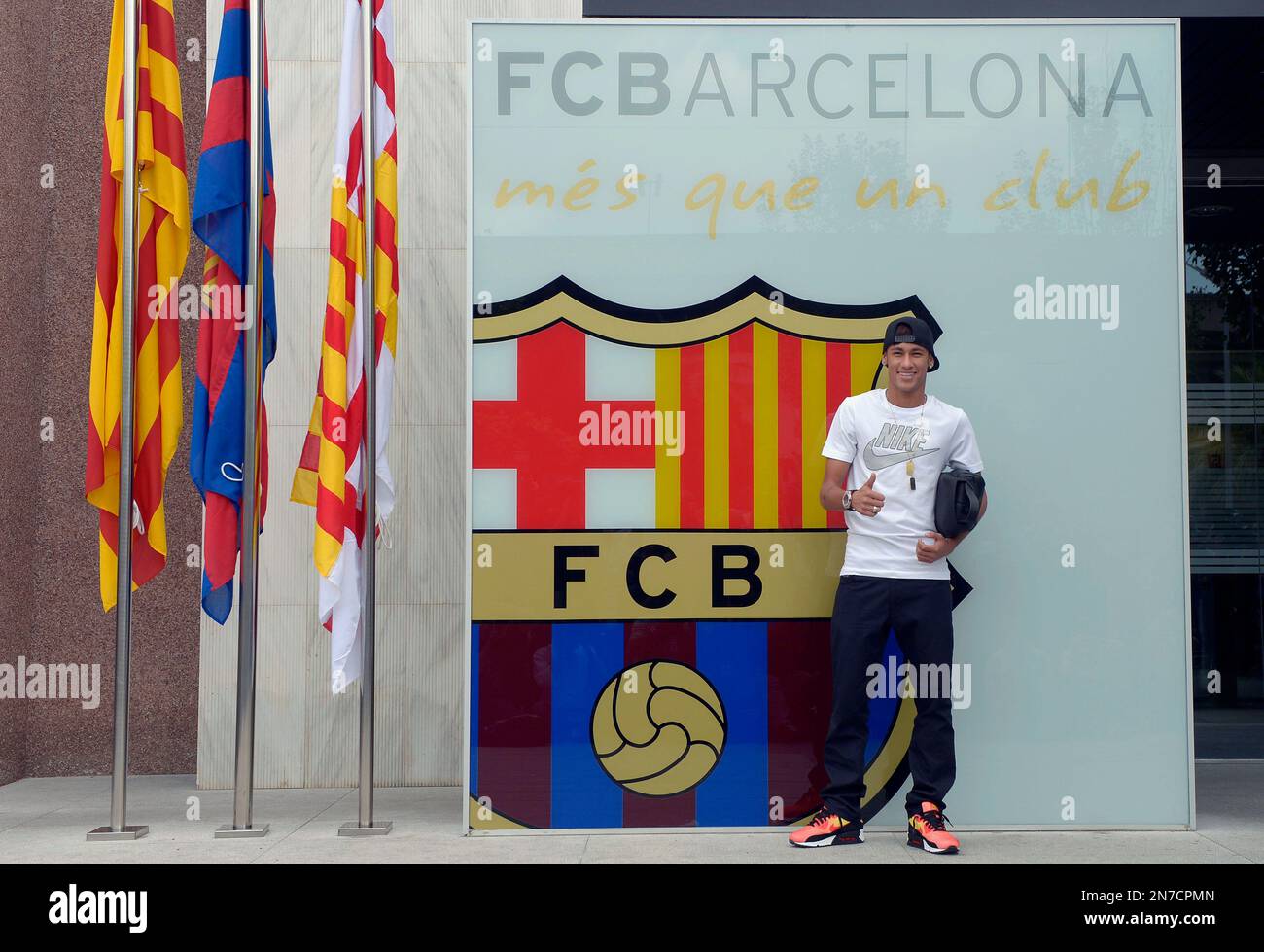 FC Barcelona's new signing Neymar gestures during his upon arrival at the  club's office at the Camp Nou stadium in Barcelona, Spain, Monday, June 3,  2013. Neymar arrived in Barcelona on Monday