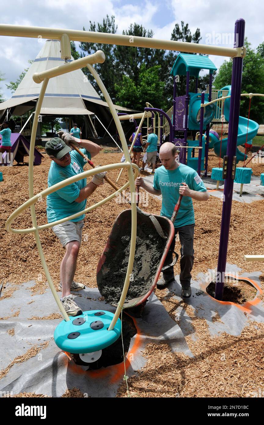 Volunteers are shown during a Foresters playground build at Camp Twin