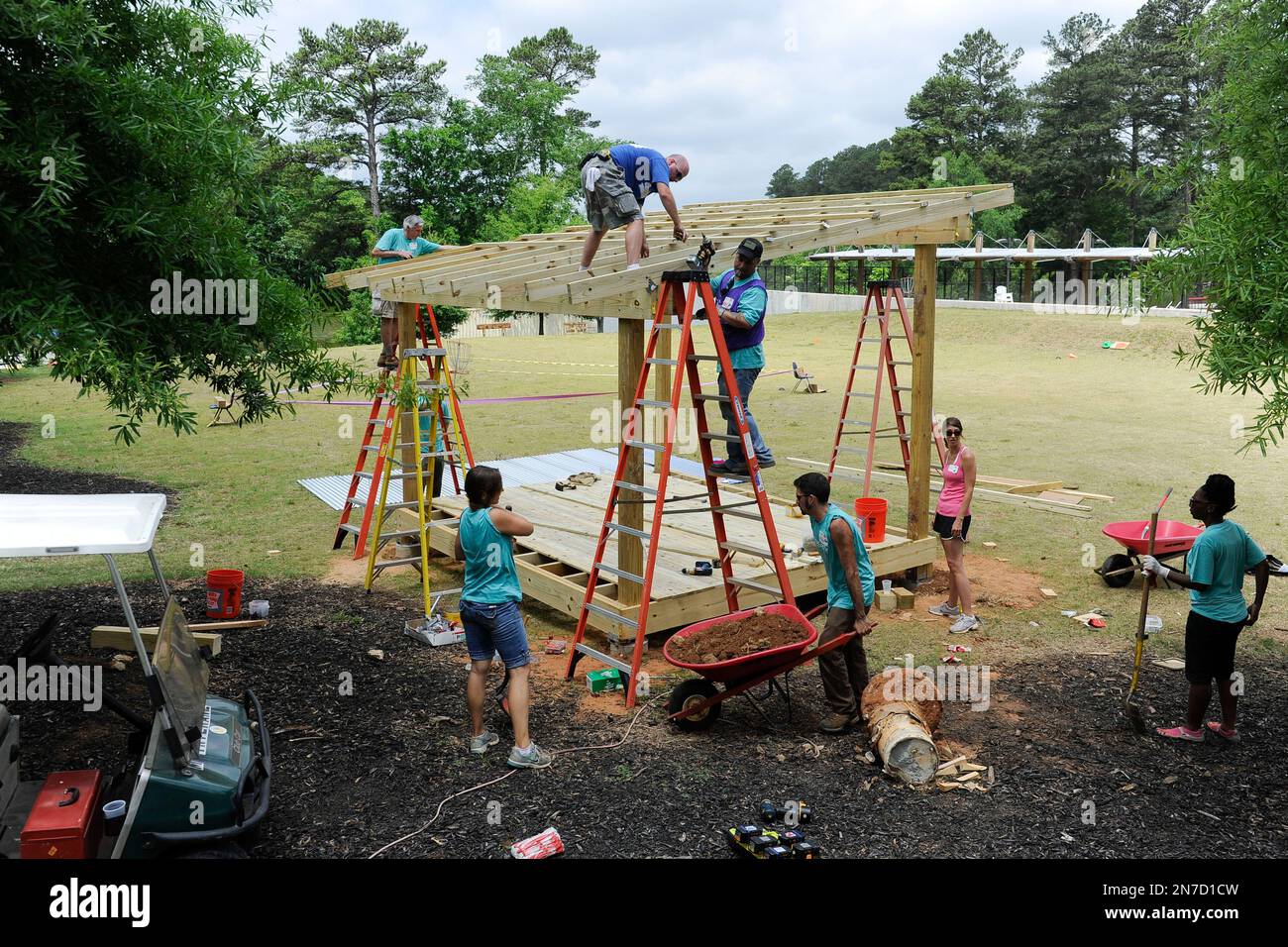 Volunteers are shown during a Foresters playground build at Camp Twin