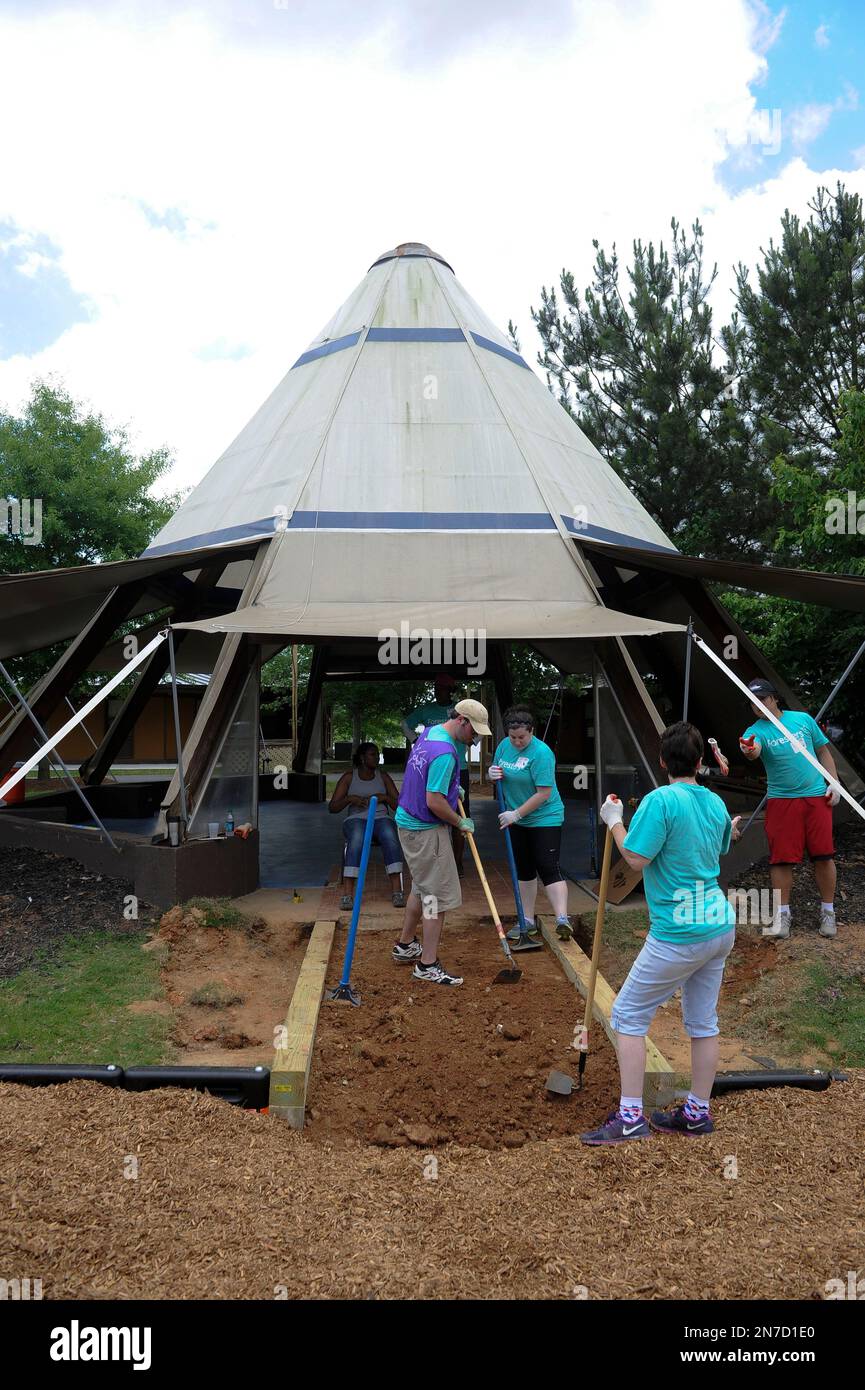 Volunteers are shown during a Foresters playground build at Camp Twin