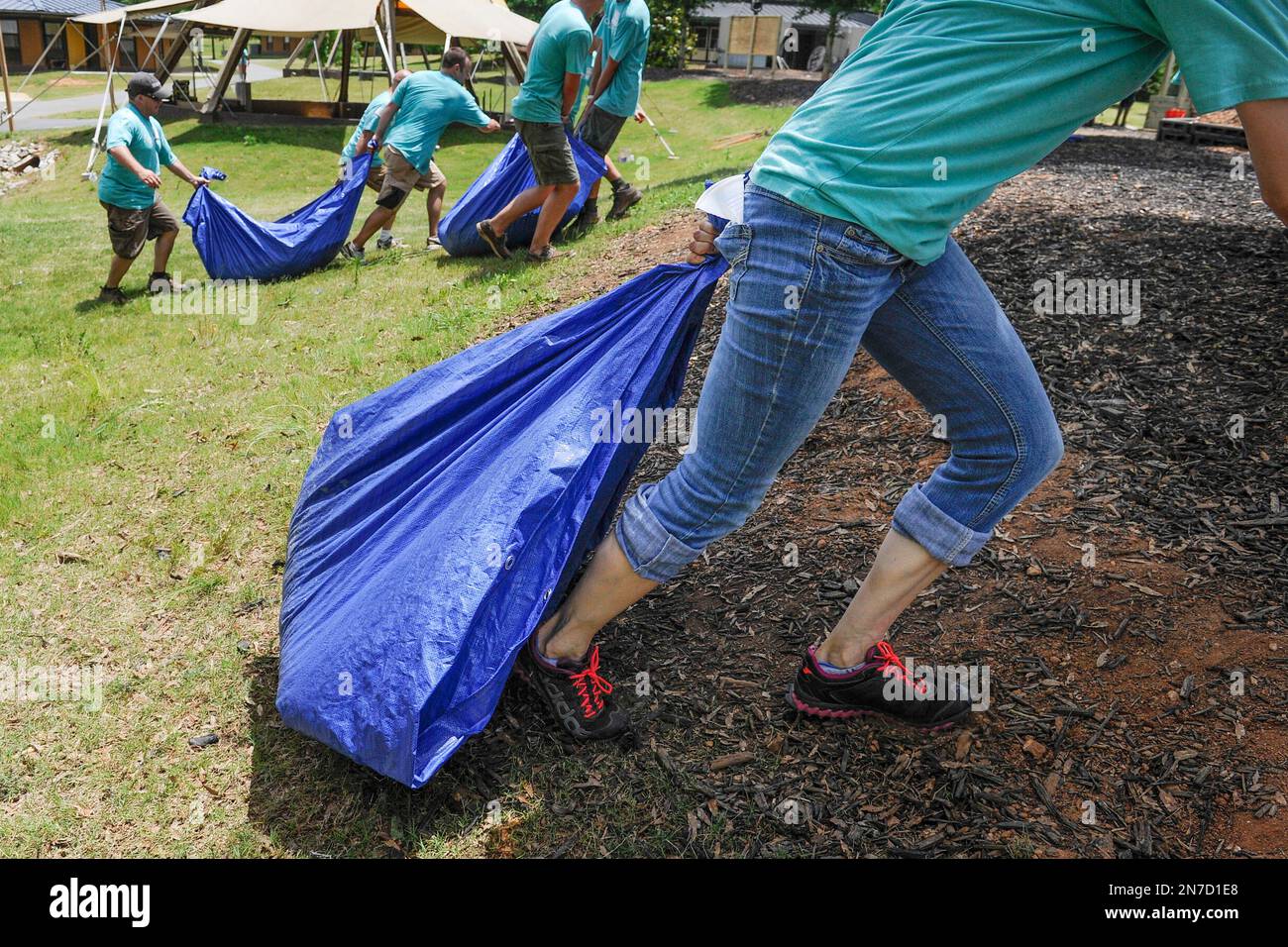 Volunteers are shown during a Foresters playground build at Camp Twin