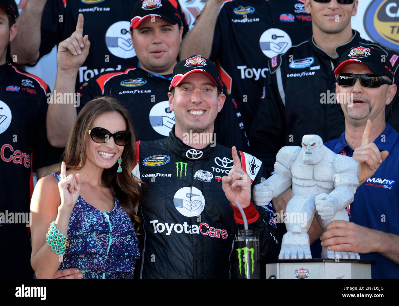 Kyle Busch, center; his wife, Samantha, left; and others celebrate in