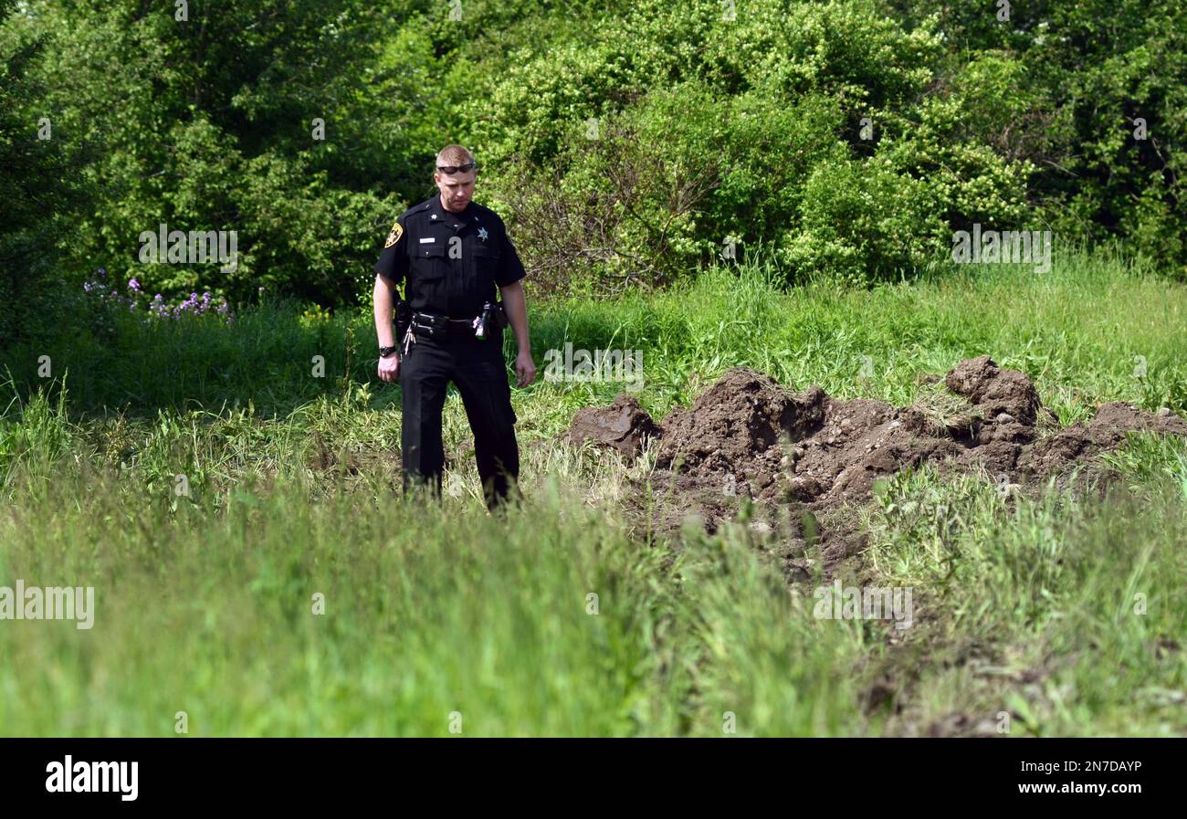 Cortland County Sheriffs Deputy John Gallagher investigates the scene