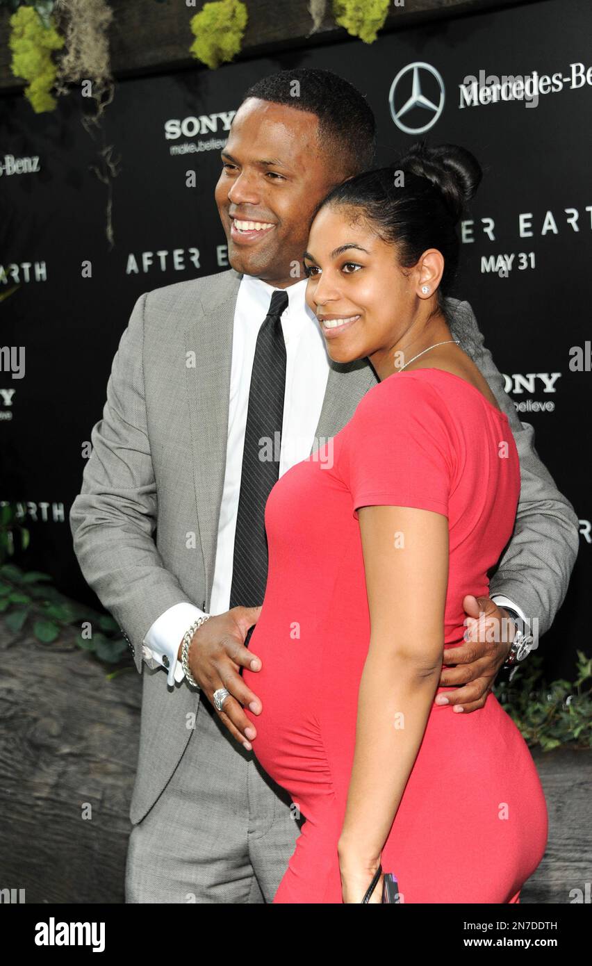 Television personality A.J. Calloway and fiancee Lao Sealey attend the