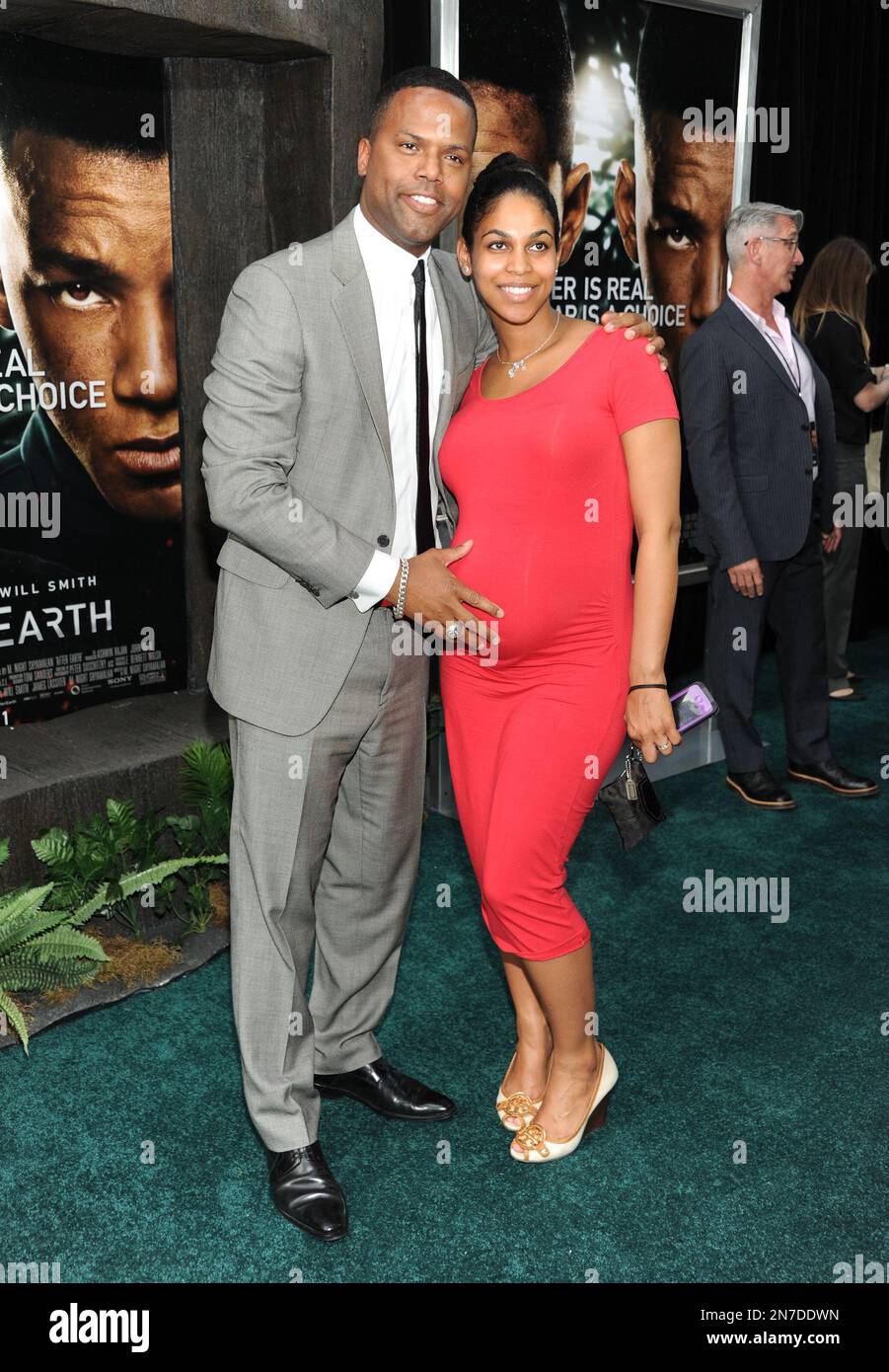 Television personality A.J. Calloway and fiancee Lao Sealey attend the "After Earth" premiere at