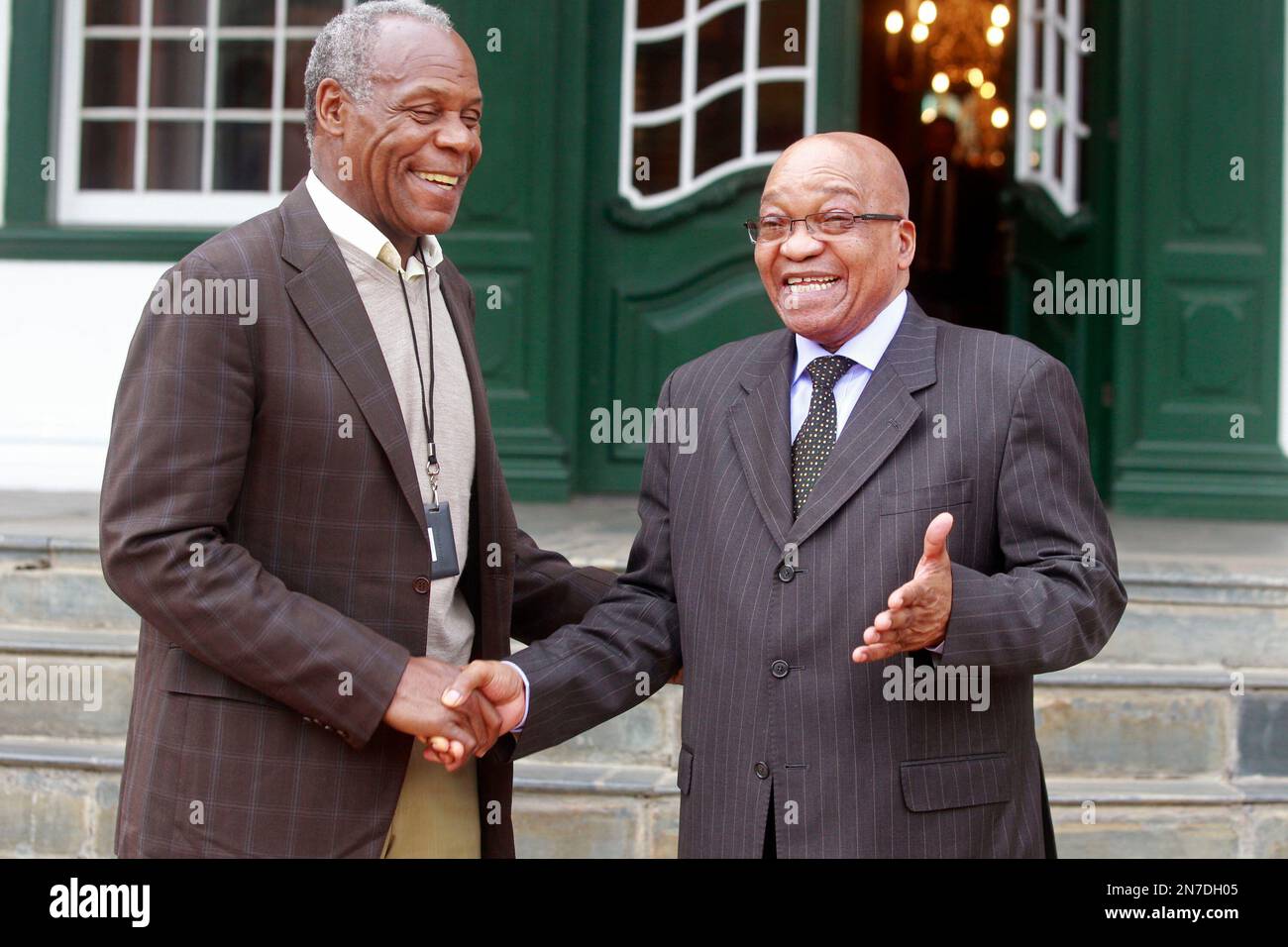 American actor and activist Danny Glover, left, reacts with South
