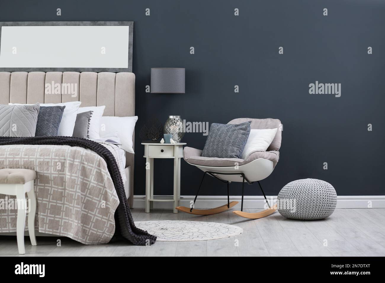 Elegant mirror over bed in stylish room interior Stock Photo Alamy