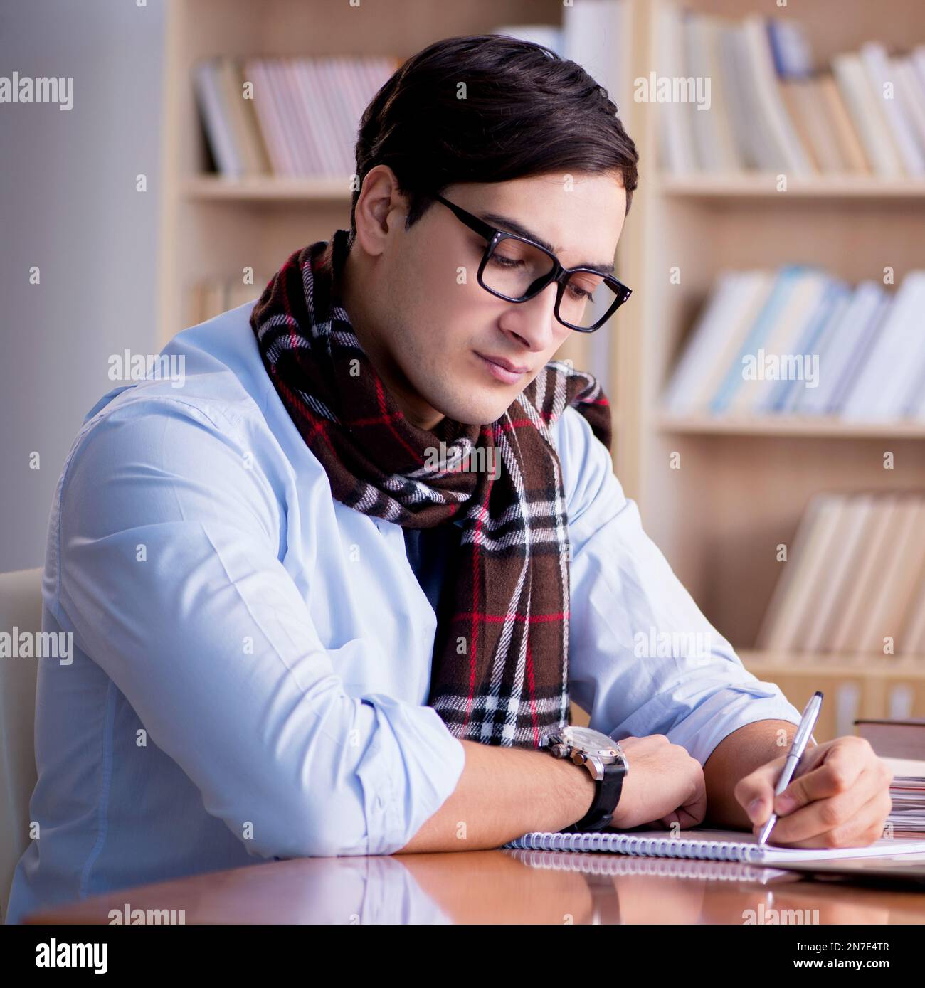 Writer In Library The young writer working in the library Stock Photo - Alamy