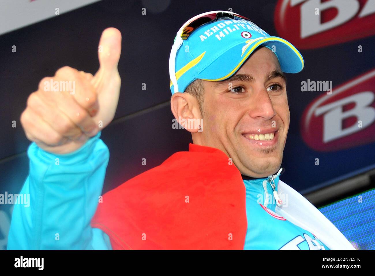 Italy's Vincenzo Nibali celebrates on the podium after winning the 20th