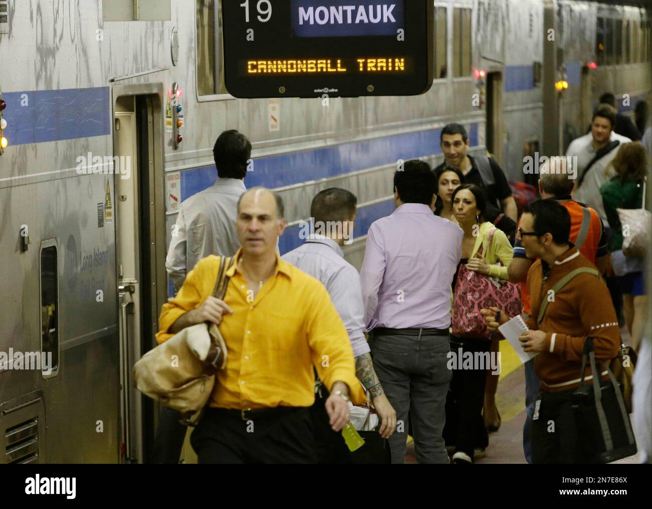 Riders board the first nonstop express train, known as the Cannonball
