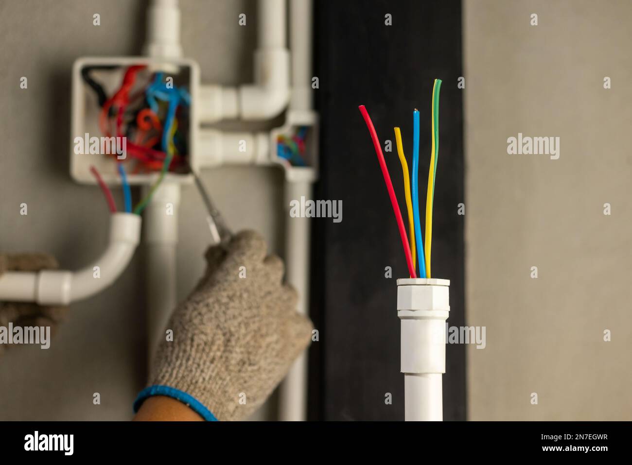 Electrician repair wire in PVC Conduit , renovate home Stock Photo Alamy