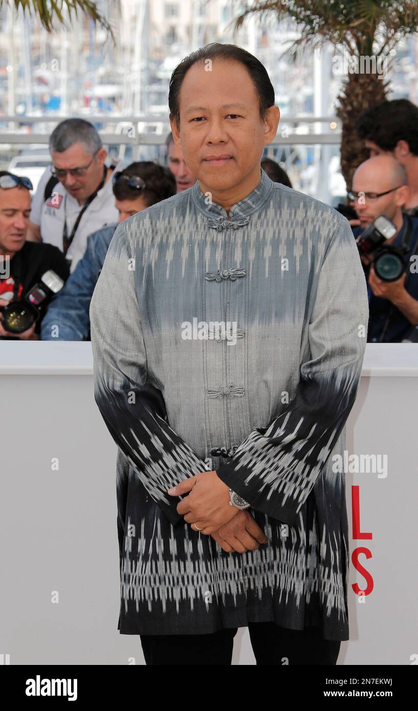 Actor Vithaya Pansringarm poses for photographers during a photo call