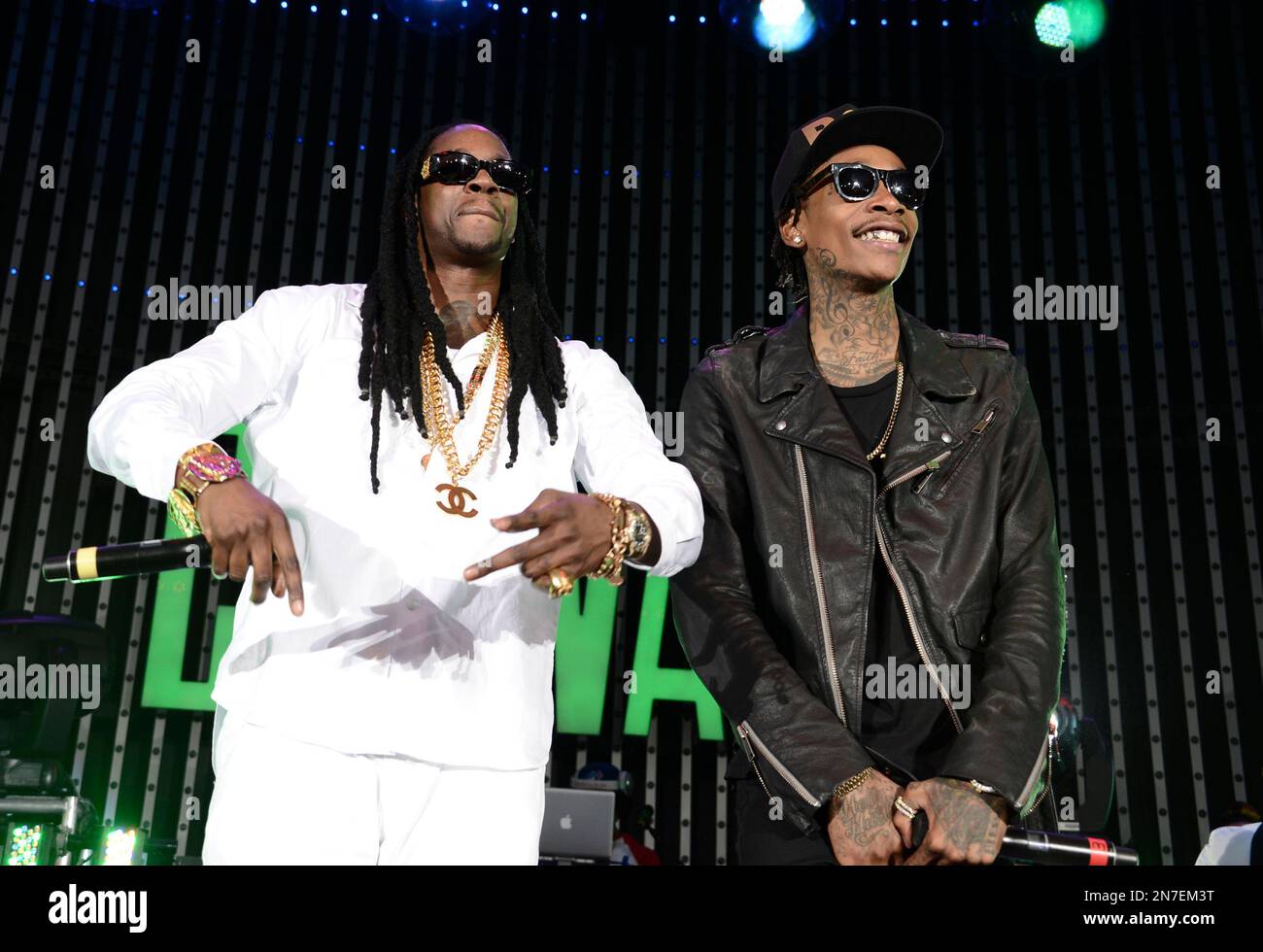 Rapper 2 Chainz and rapper Wiz Khalifa performs at the LA Premiere