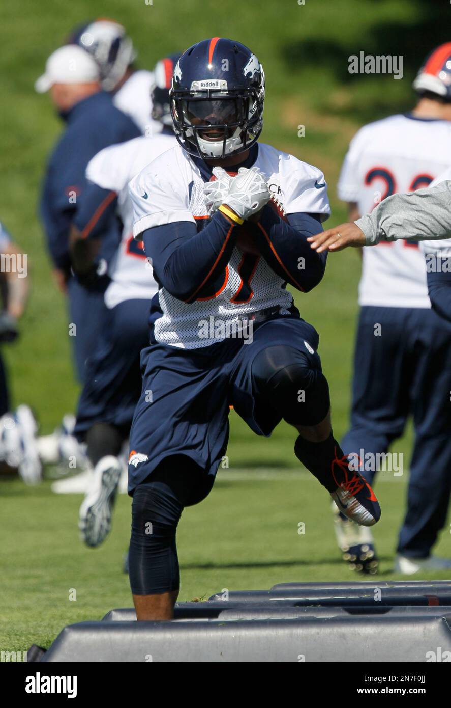 Denver Broncos running back Jeremiah Johnson takes part in drills