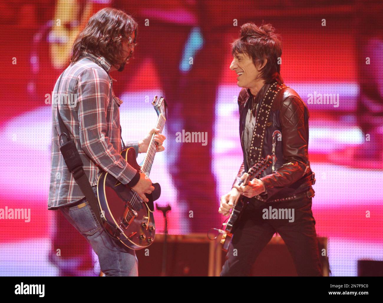 Dave Grohl, left, and RonnieWood of the Rolling Stones performs on the