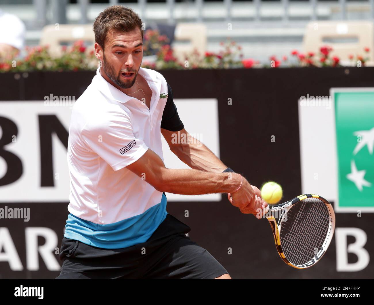 Frances Benoit Paire returns the ball to Italys Stefano Travaglia during their match at the Italian Open tennis tournament, in Rome, Monday, May 10, 2021