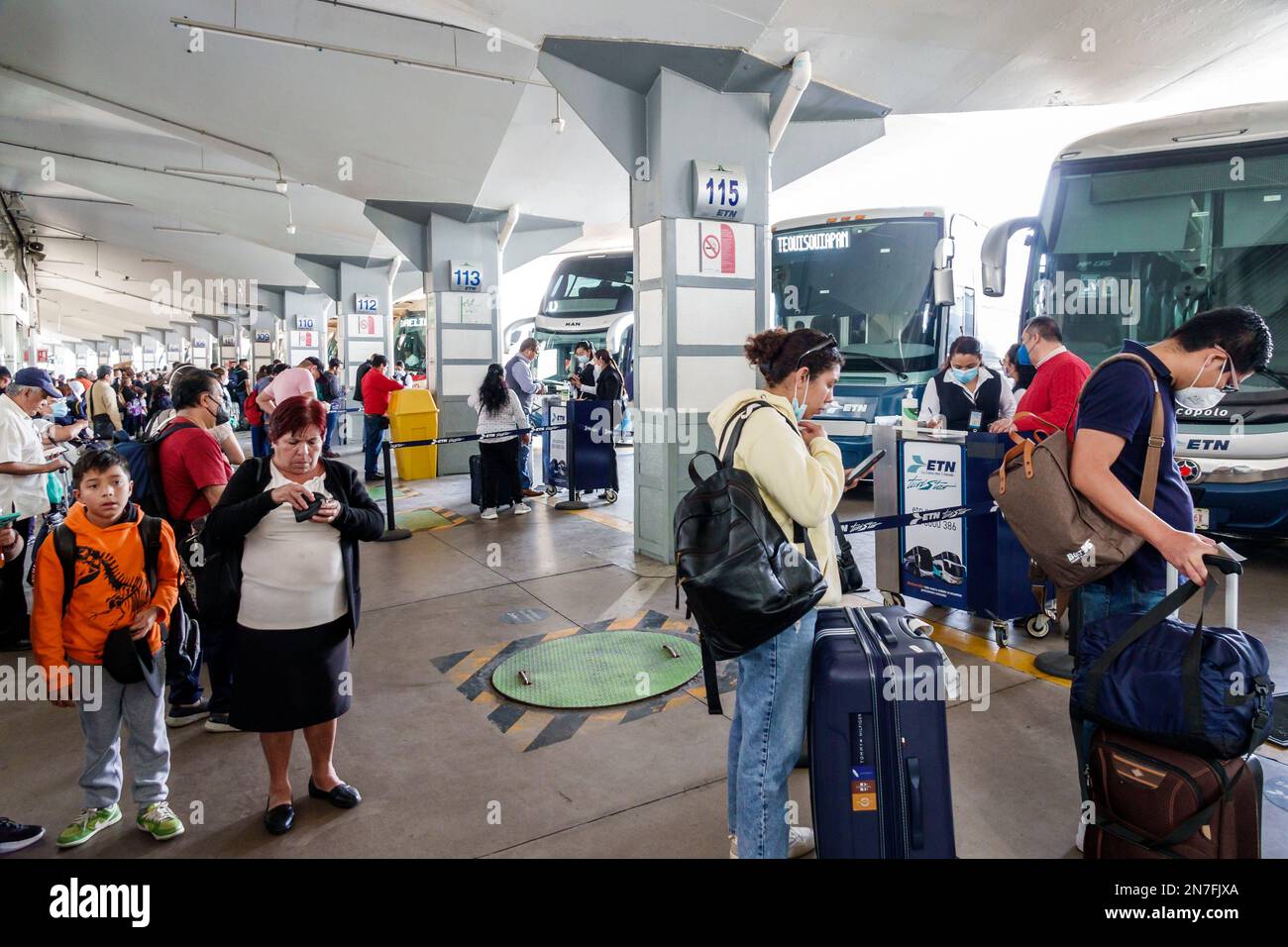 Mexico City,Central de Autobuses del Norte,Northern Bus Station,passengers riders luggage suitcase,boarding area,bus line motorcoach motorcoaches serv Stock Photo