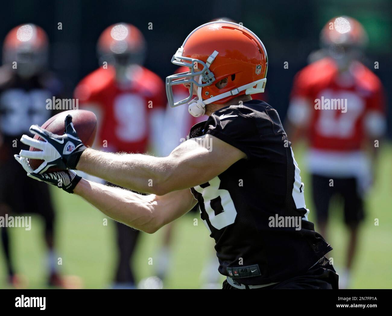 Cleveland Browns running back Owen Marecic catches a pass at an off-season  practice at the NFL football team's headquarters in Berea, Ohio Wednesday,  June 6, 2012. (AP Photo/Mark Duncan Stock Photo -
