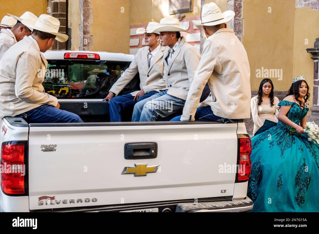 San Miguel de Allende Guanajuato Mexico,Historico Central historic center Zona Centro,sitting in pickup truck,theme party guests wearing cowboy hat ha Stock Photo