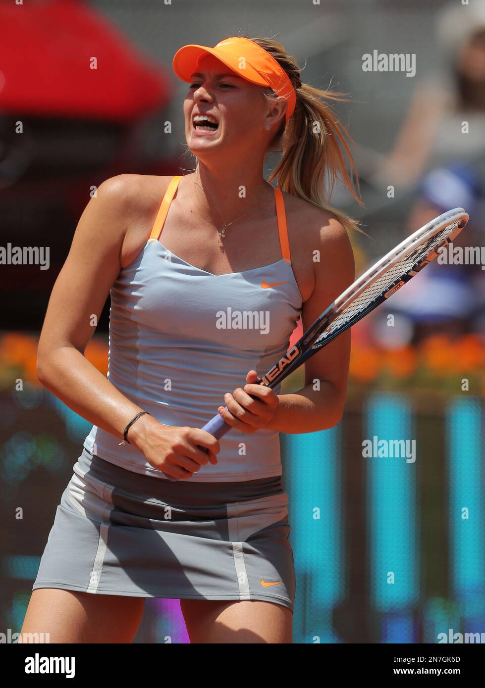 Justine Henin-Hardenne of Belgium seen with trophy after defeating Maria  Sharpova of Russia 7-5, 6-2 in the finals of the Dubai Tennis Championships  in Dubai, United Arab Emirates on February 25, 2006.